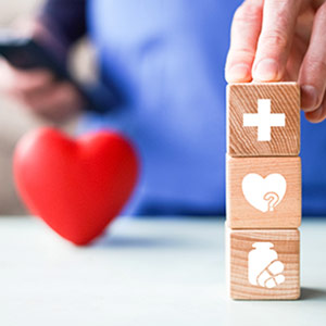 stacked wooden blocks with health symbols